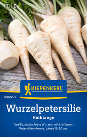 Weiße, glatte Wurzeln mit grünen Blättern, auf Holz liegend.