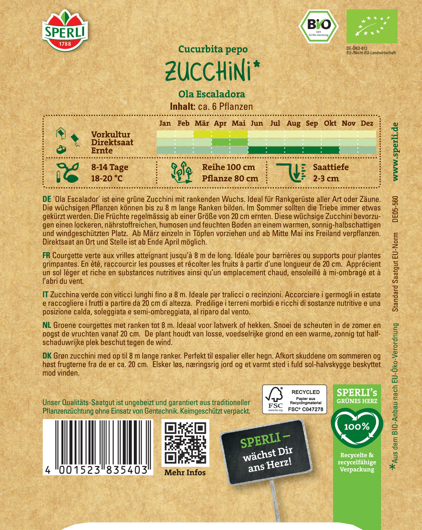 Bunte Packet mit grüner Zucchini, Text, Logos und Barcode auf braunem Hintergrund.