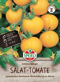 Gelbe Salat-Tomaten, auf einer Holzfläche, mit grünen Blättern und einem schwarzen Etikett.