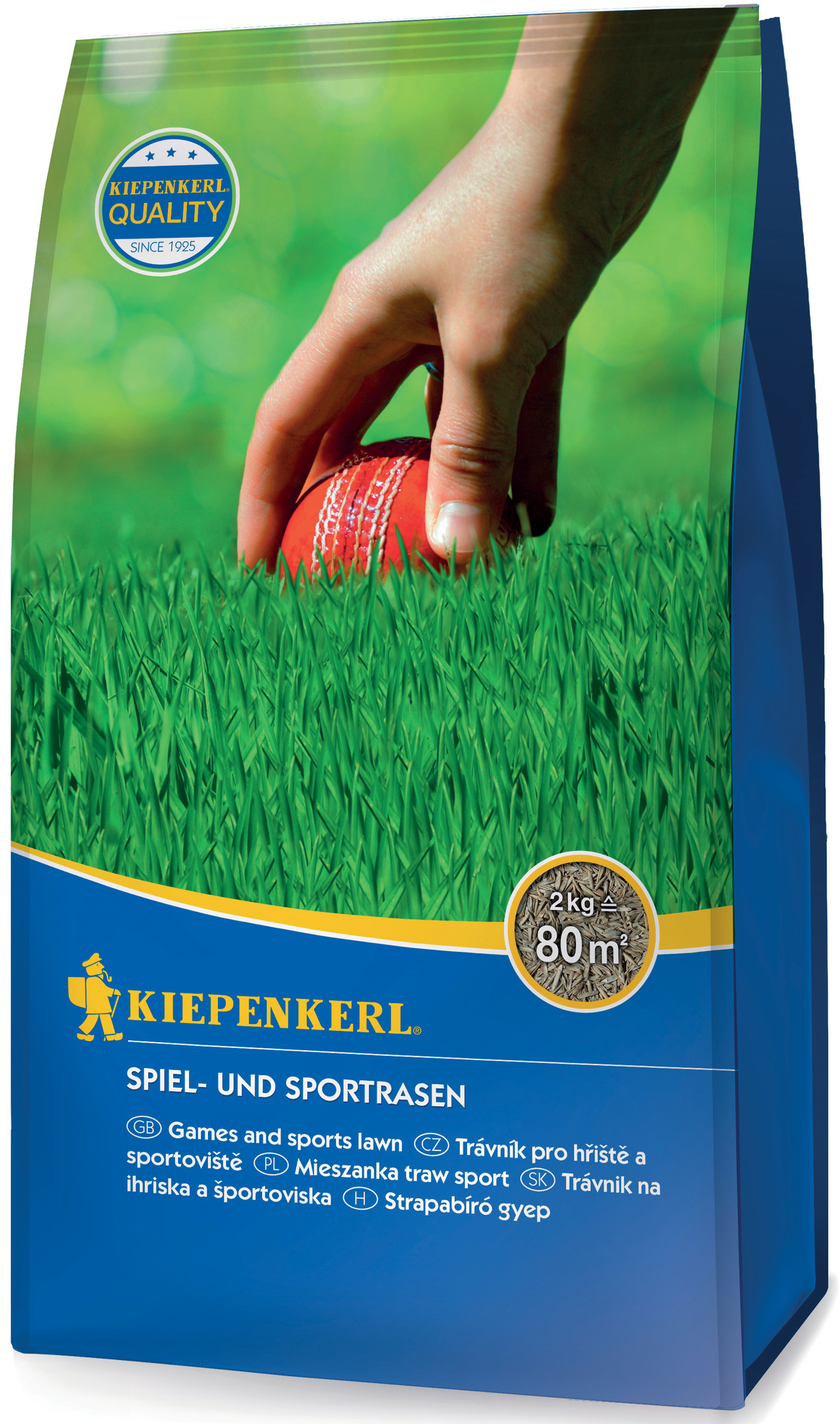 Hand legt einen roten Tennisball auf Grasteppich, Hintergrund unscharf grün.