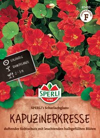Red and green nasturtium flowers and leaves, with a plant label and packaging branding visible.