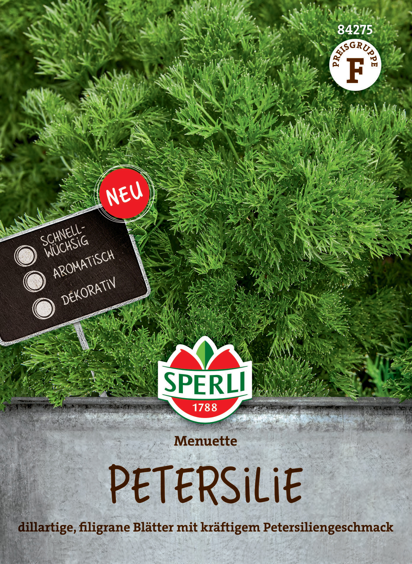 Petersilie mit dünnfliegenden Blättern und kräftigem Petersilgeschmack, in einem Körbchen auf grünem Hintergrund.